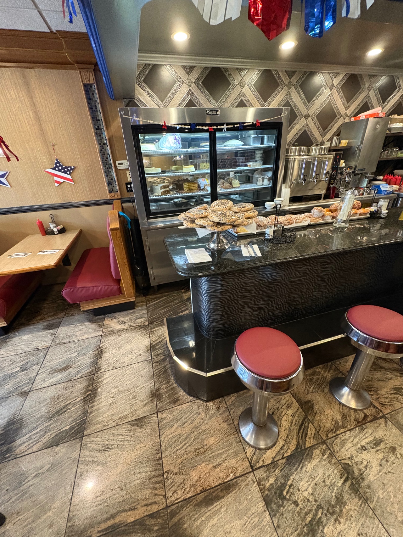 Dessert case and counter with stools